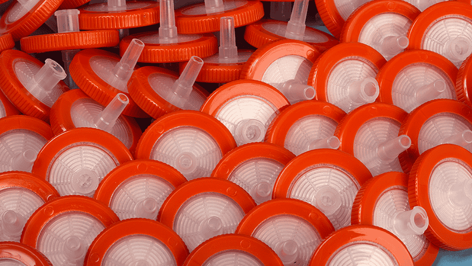 Pile of red and white syringe filters.