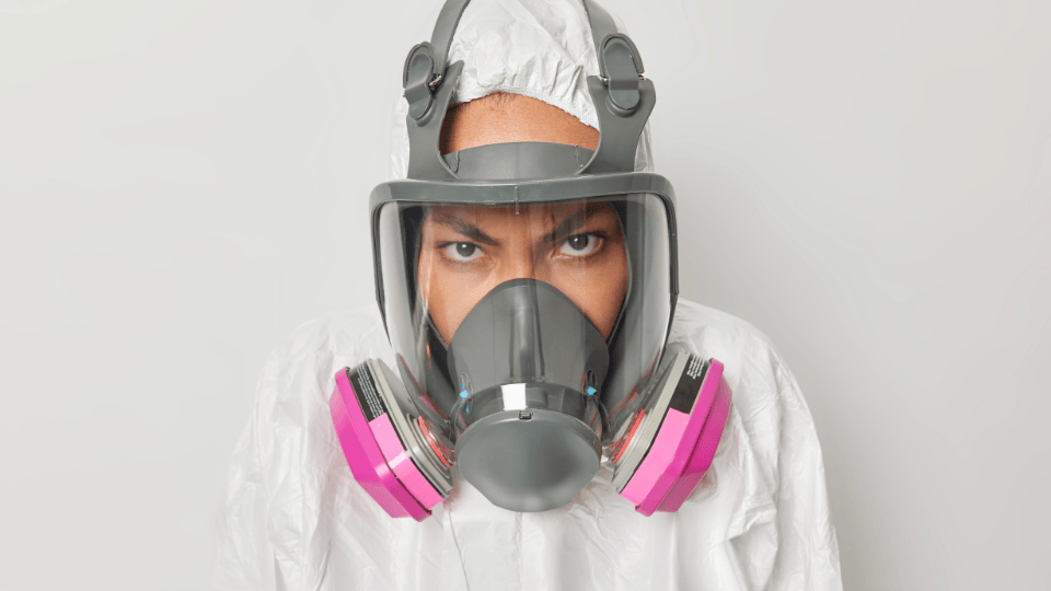 Person in a GVS respirator and safety suit, ready for hazardous conditions